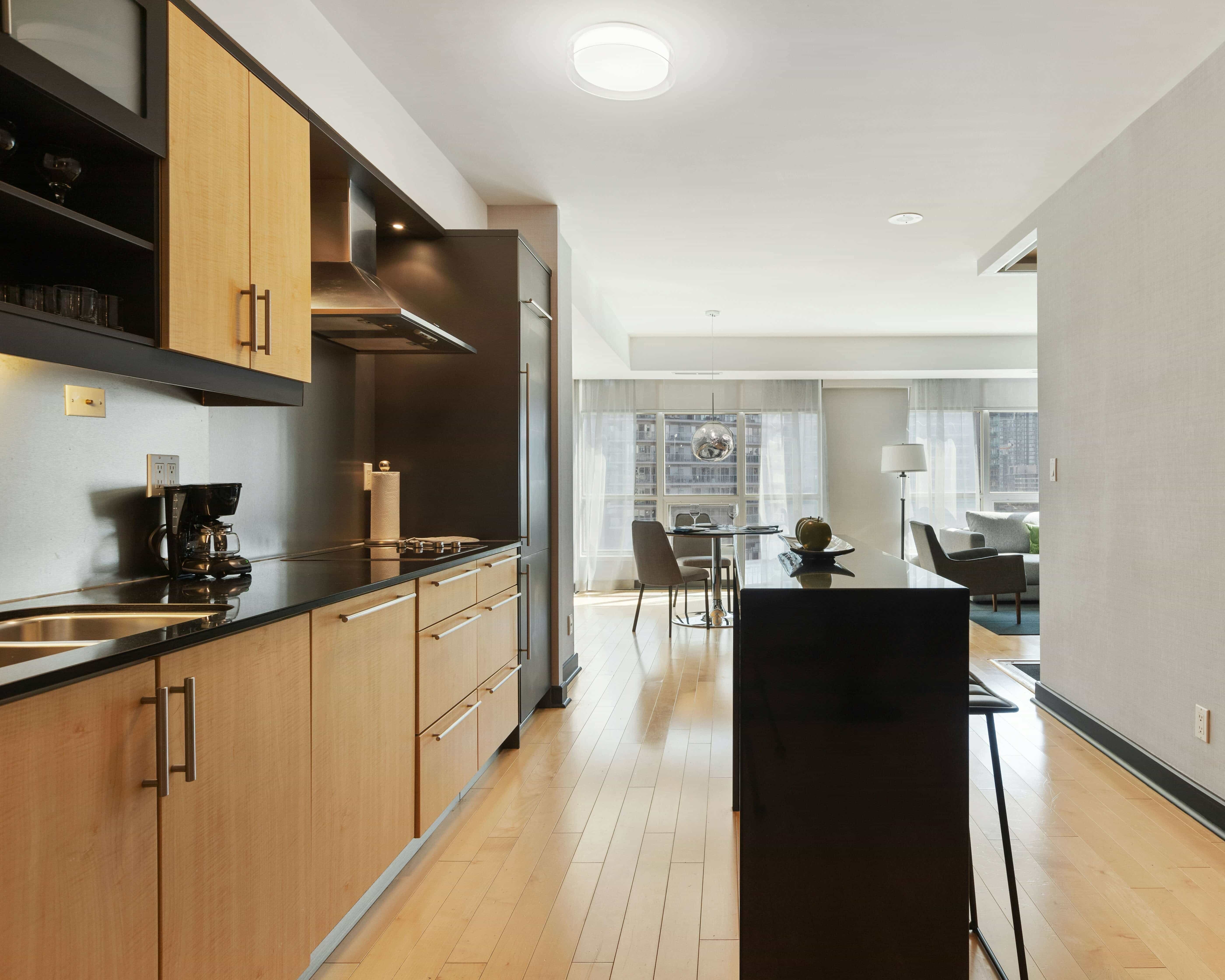 Full view of a kitchen with white cabinets